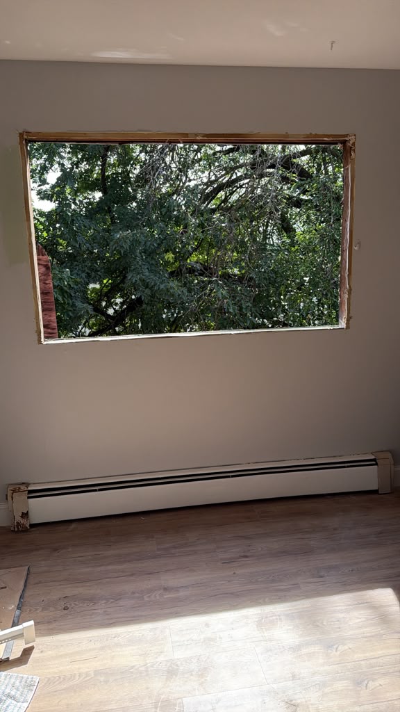 Residential wall opening prepared for replacement windows in Ridgewood, New Jersey